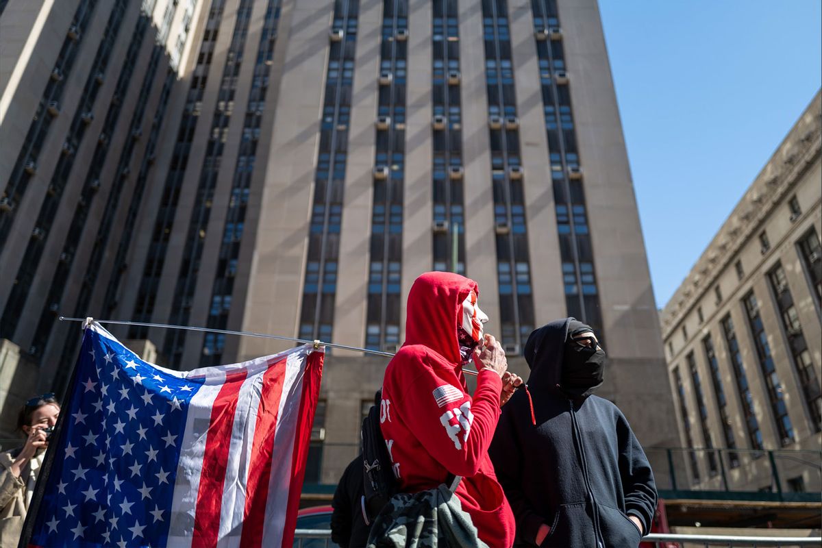 People gather outside of a Manhattan courthouse as the nation waits for the possibility of an indictment against former president Donald Trump by the Manhattan District Attorney Alvin Bragg's office on March 21, 2023 in New York City. (Spencer Platt/Getty Images)