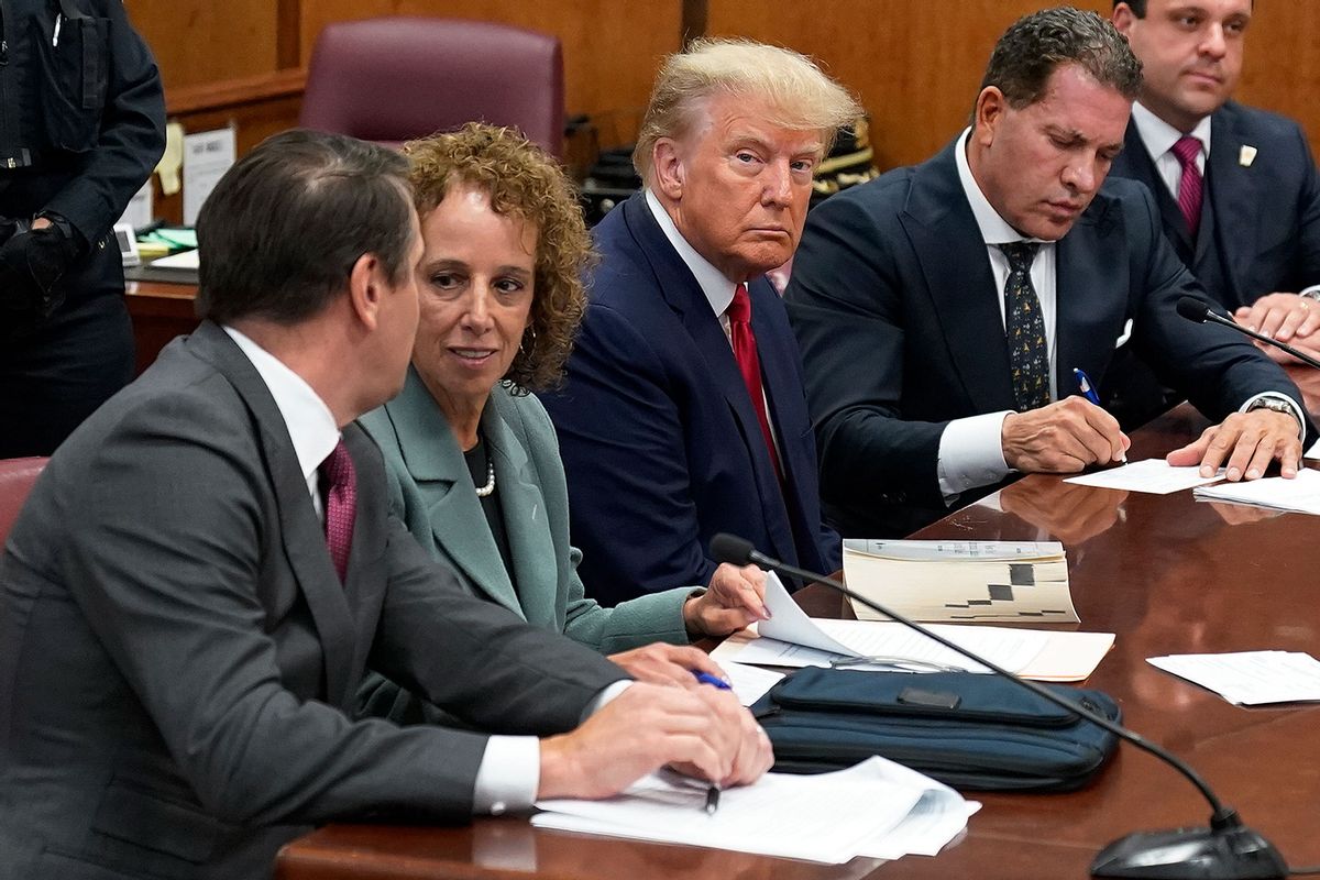 Former U.S. President Donald Trump sits at the defense table with his defense team in a Manhattan court during his arraignment on April 4, 2023, in New York City. (Seth Wenig-Pool/Getty Images)