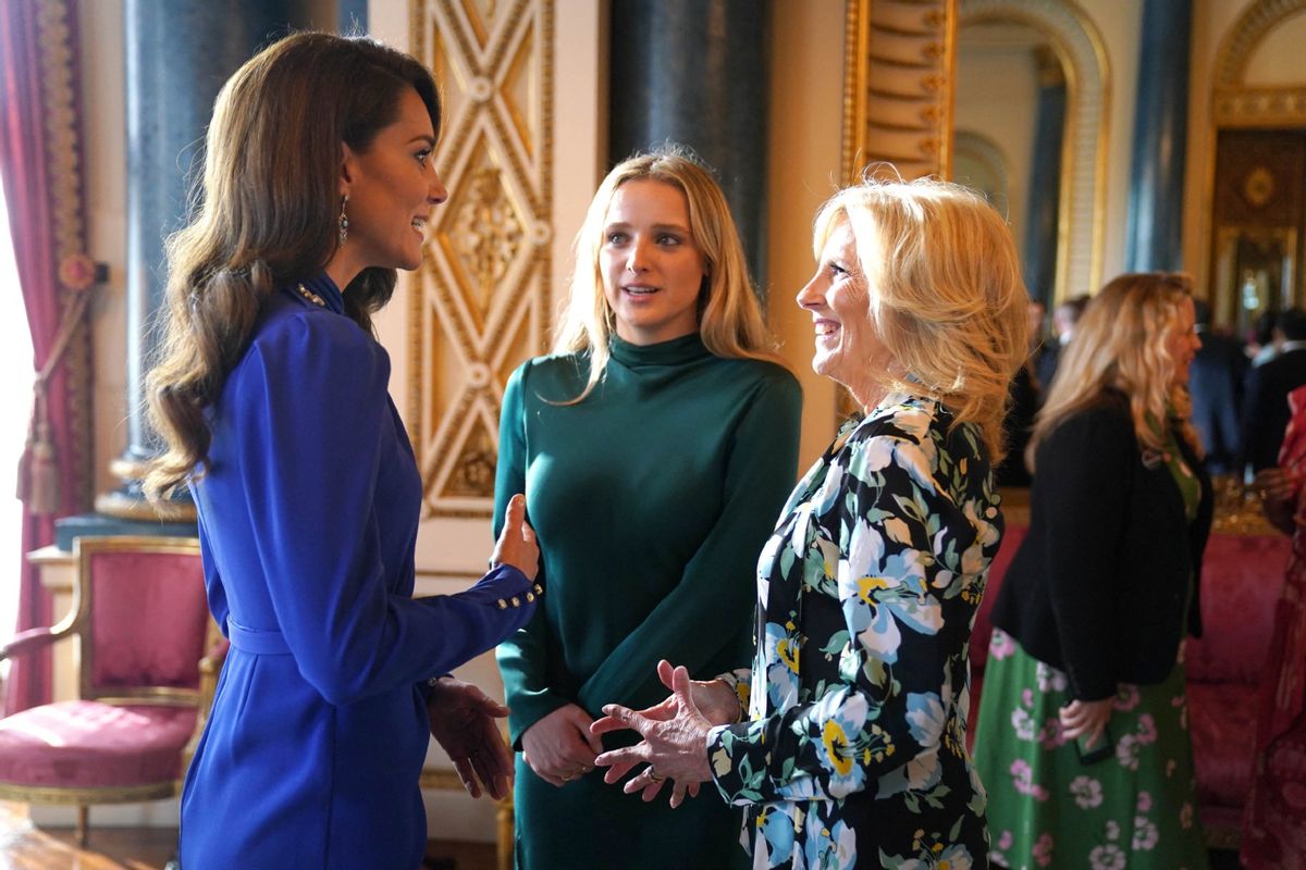 Britain's Catherine, Princess of Wales (L) speaks with US First Lady Jill Biden (R) and her grand daughter Finnegan Biden (C) during a reception for overseas guests attending the coronation of Britain's King Charles III, at Buckingham Palace in central London on May 5, 2023. (JACOB KING/POOL/AFP via Getty Images)