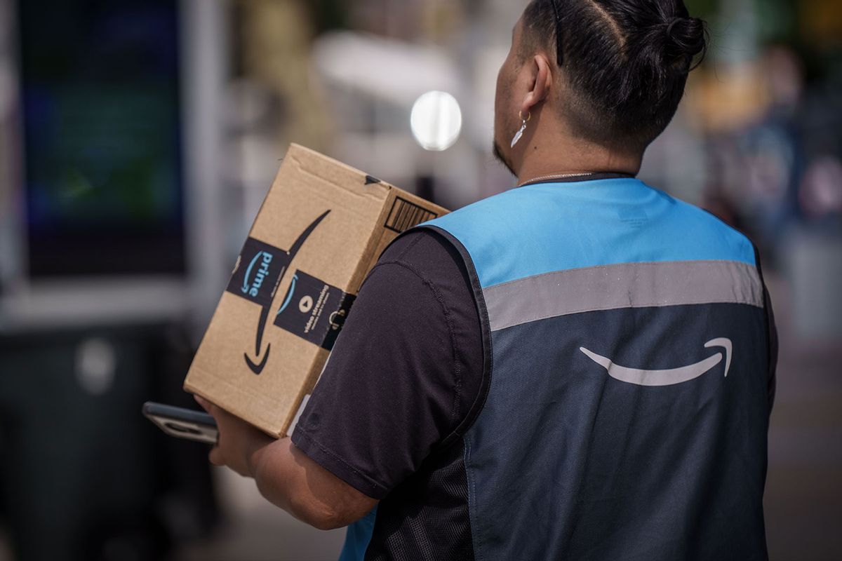 Amazon messenger delivers a package (Michael Kappeler/picture alliance via Getty Images)