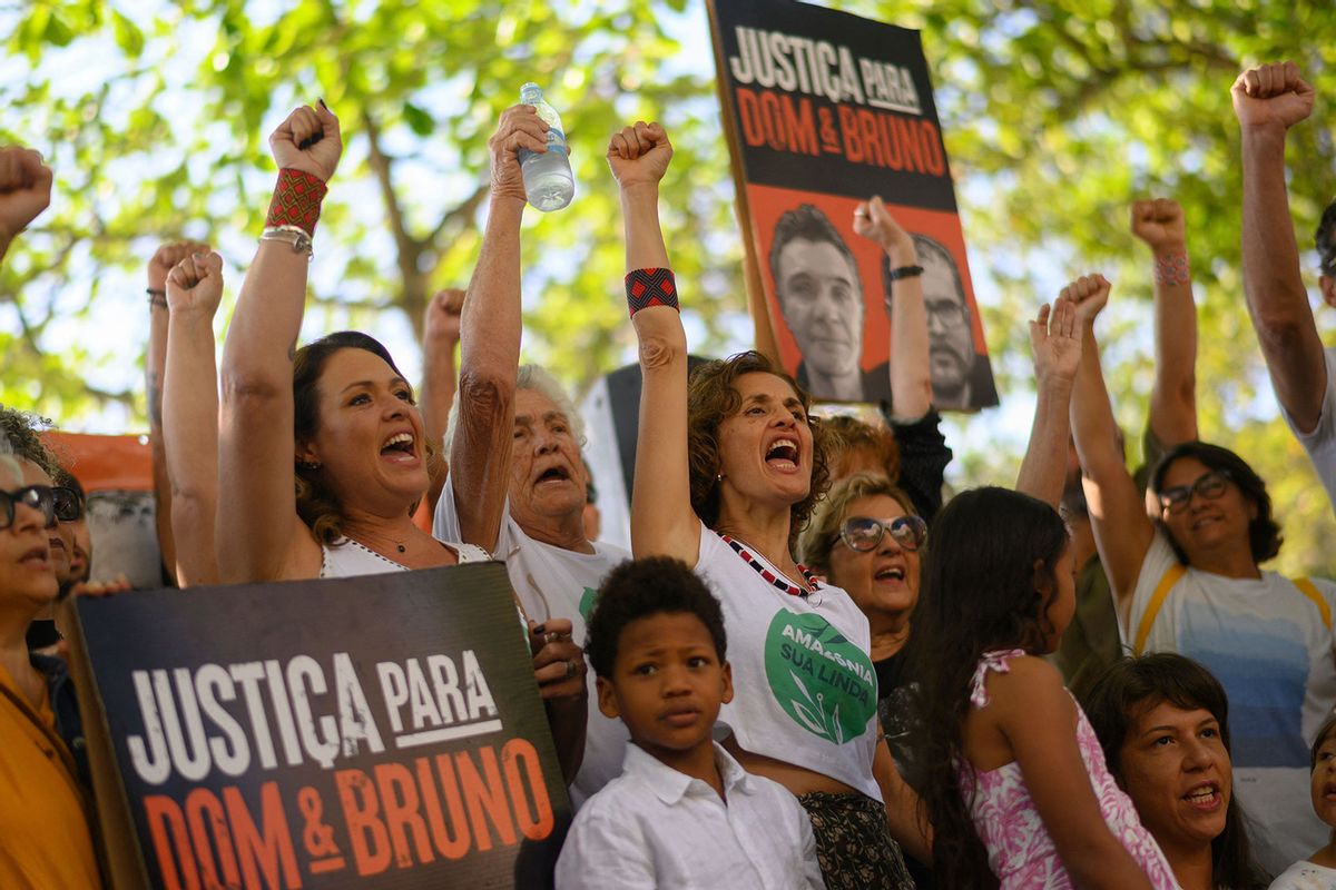 Alessandra Sampaio (C), widow of British journalist Dom Phillips, participates in a demonstration in tribute to Phillips and Brazilian indigenous expert Bruno Pereira, murdered while on a reporting mission in the Amazon rainforest one year ago, at the Copacabana neighborhood in Rio de Janeiro, Brazil, on June 5, 2023. (MAURO PIMENTEL/AFP via Getty Images)