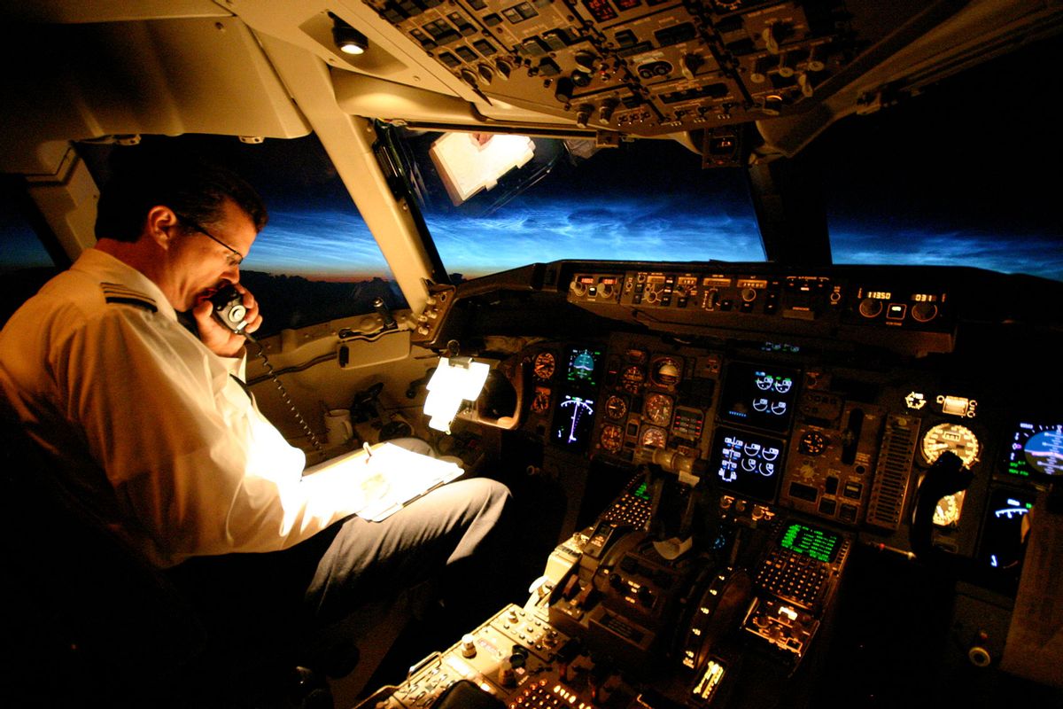 Captain flying a Boeing 767 over the North Atlantic just before dawn (Getty Images/Kent Wien)
