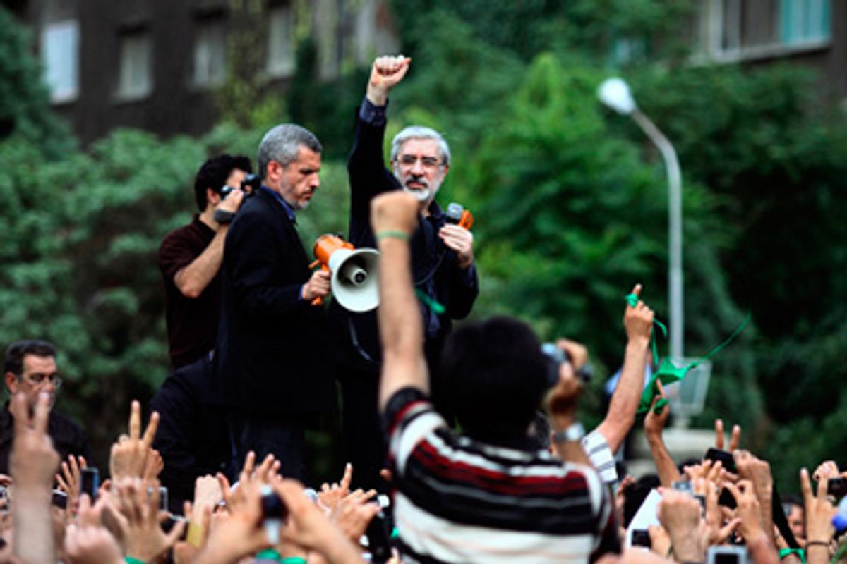 Defeated Iranian presidential candidate Mirhossein Mousavi speaks to supporters at a rally in Tehran June 18, 2009.