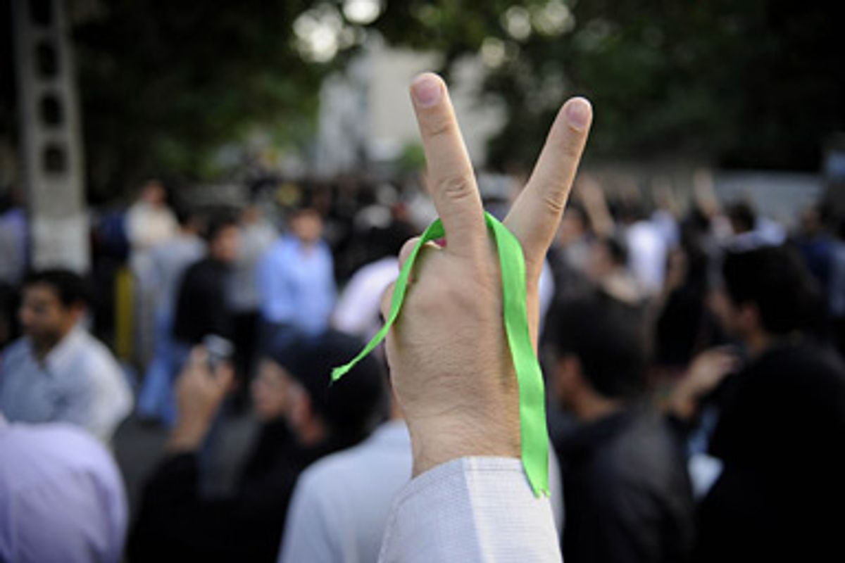 In this citizen photograph taken Sunday, June 28, 2009, a supporter of pro-reform leader Mir Hossein Mousavi, flashes a victory sign during a gathering at the Ghoba Mosque in Tehran, Iran. Several thousand protesters who had gathered near north Tehran's Ghoba Mosque clashed with riot police in Tehran on Sunday in the country's first major post-election unrest in four days.