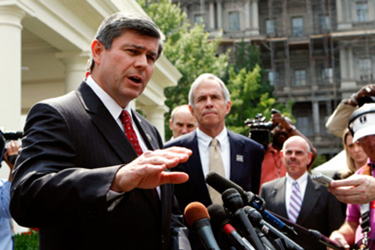 Congressman Mike Ross, L, (D-Ark.) speaks to reporters after he and a group of fellow Democratic Congressmen met with U.S. President Barack Obama about overhauling the healthcare system at the White House in Washington July 21, 2009.