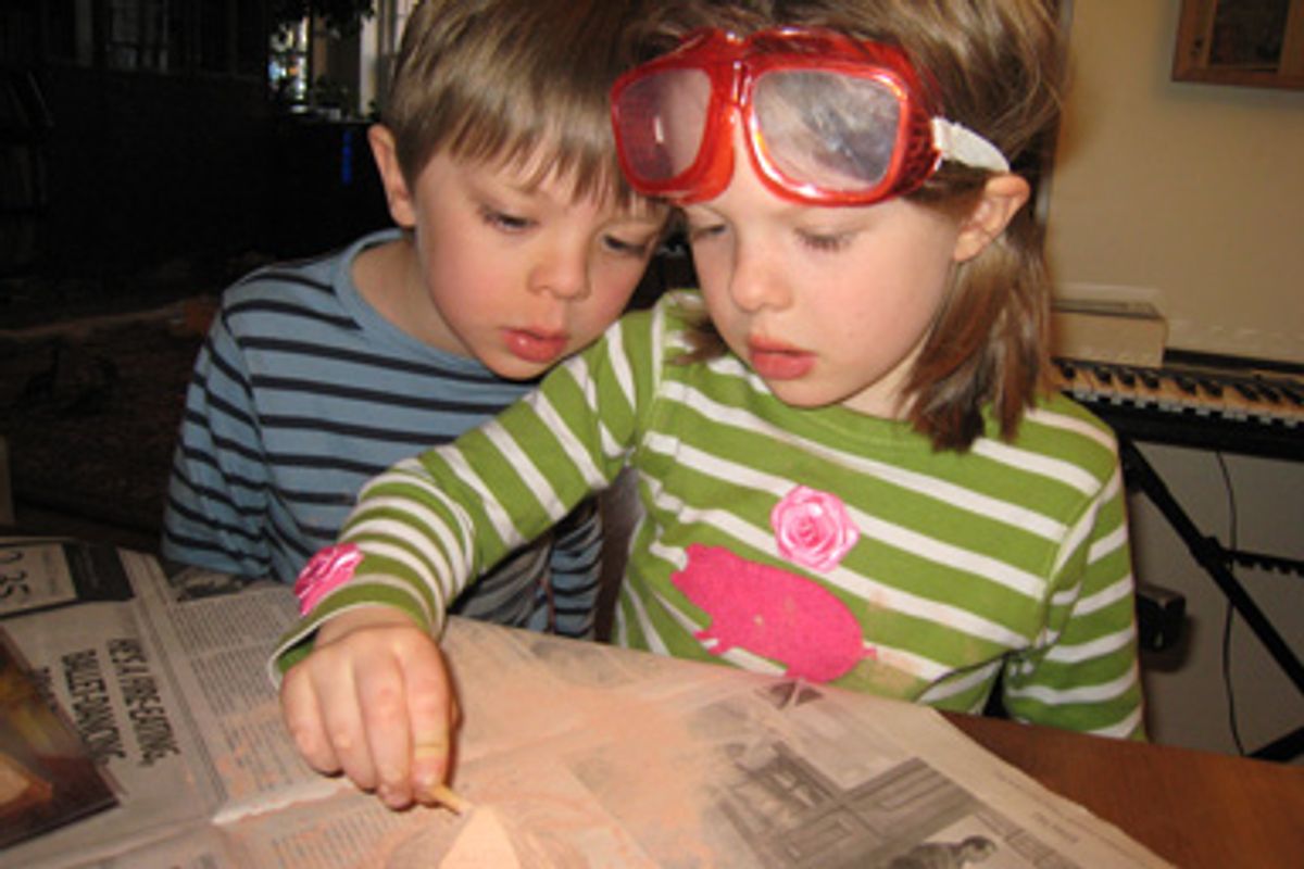 Desmond and Nini, the author's homeschooled children, during an "archaeological dig."
