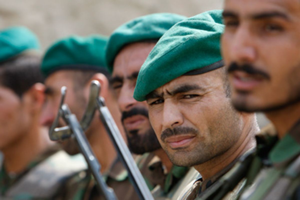 Afghan National Army soldiers stand in formation during a deployment drill ahead of Afghanistan's Presidential elections in their base near the village of Pashad in Kunar province, August 15, 2009.