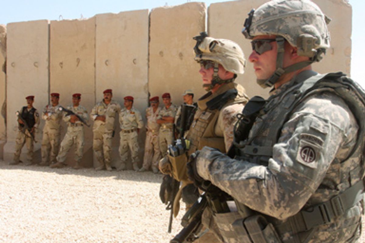 U.S. soldiers stand guard during a ceremony of the withdrawal of U.S. troops from a base in Falluja, 50 km (32 miles) west of Baghdad September 2, 2009.
