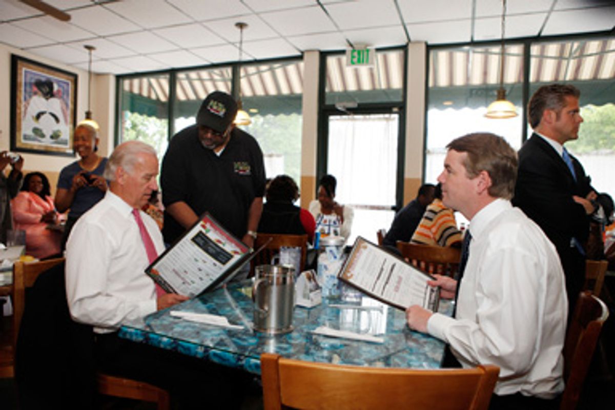 Mack Sheav takes Vice President Joe Biden food order at the M&amp;D Cafe in Denver on Tuesday, May 26, 2009, as he sits with Sen. Michael Bennet, D-Colo.