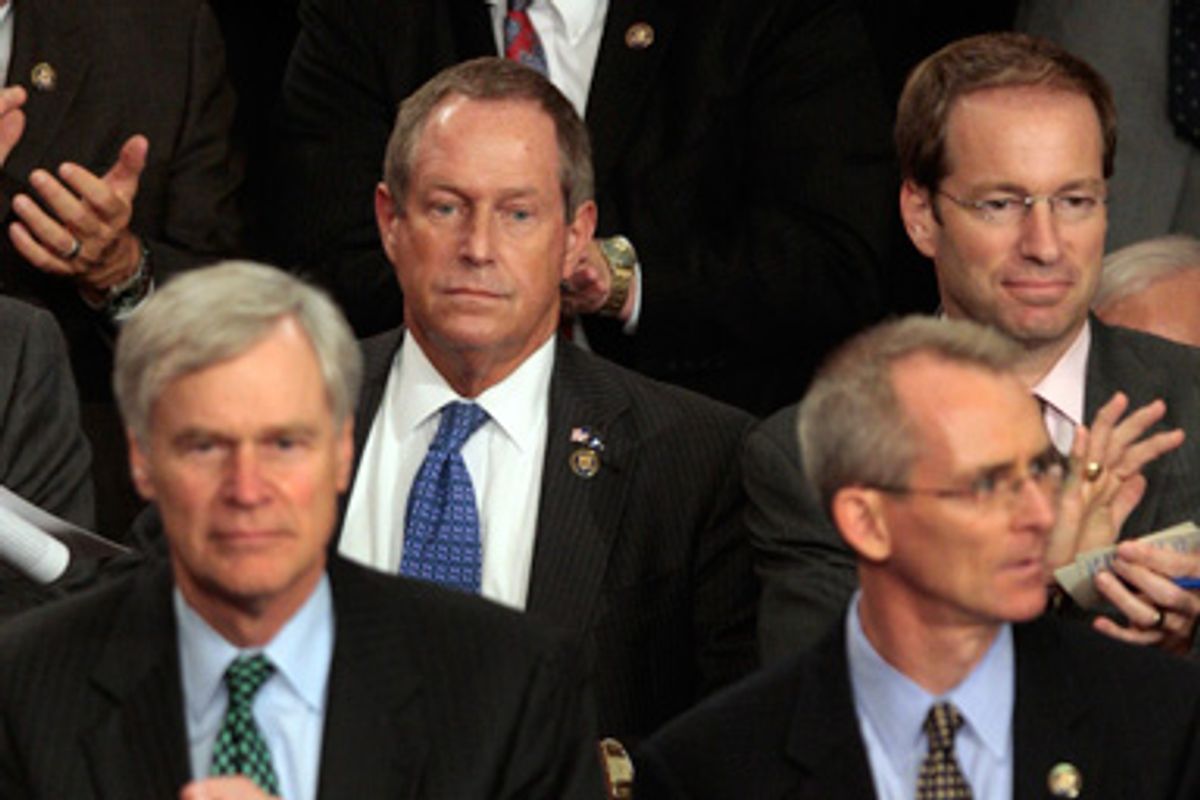 Rep. Joe Wilson, R-S.C., center, listens during President Barack Obama's speech on health care to a joint session of Congress , Wednesday, Sept., 9, 2009 on Capitol Hill in Washington.   