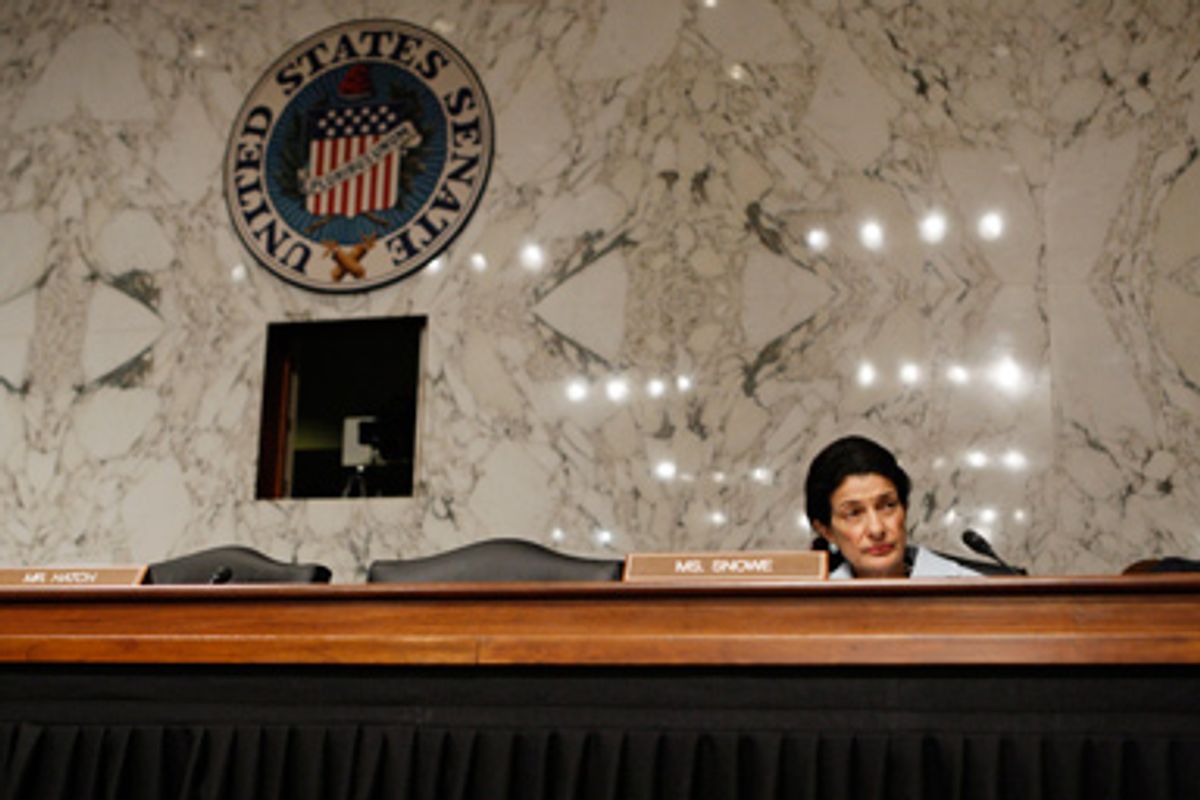 Senate Finance Committee member Sen. Olympia Snowe, R-Maine, sits amidst empty seats on the Republican side of the dais during the committee's hearing regarding health care reform, Tuesday, Oct. 13, 2009, on Capitol Hill in Washington.