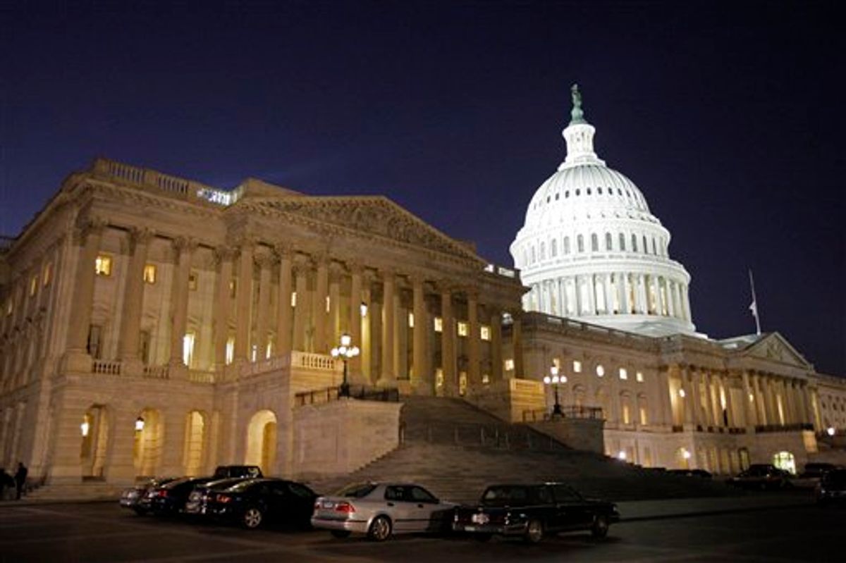 The lights burn inside of the House of Representatives side of the U.S. Capitol late Saturday night, Nov. 7, 2009 in Washington as the health care bill is debated. (AP Photo/Alex Brandon) (Associated Press)