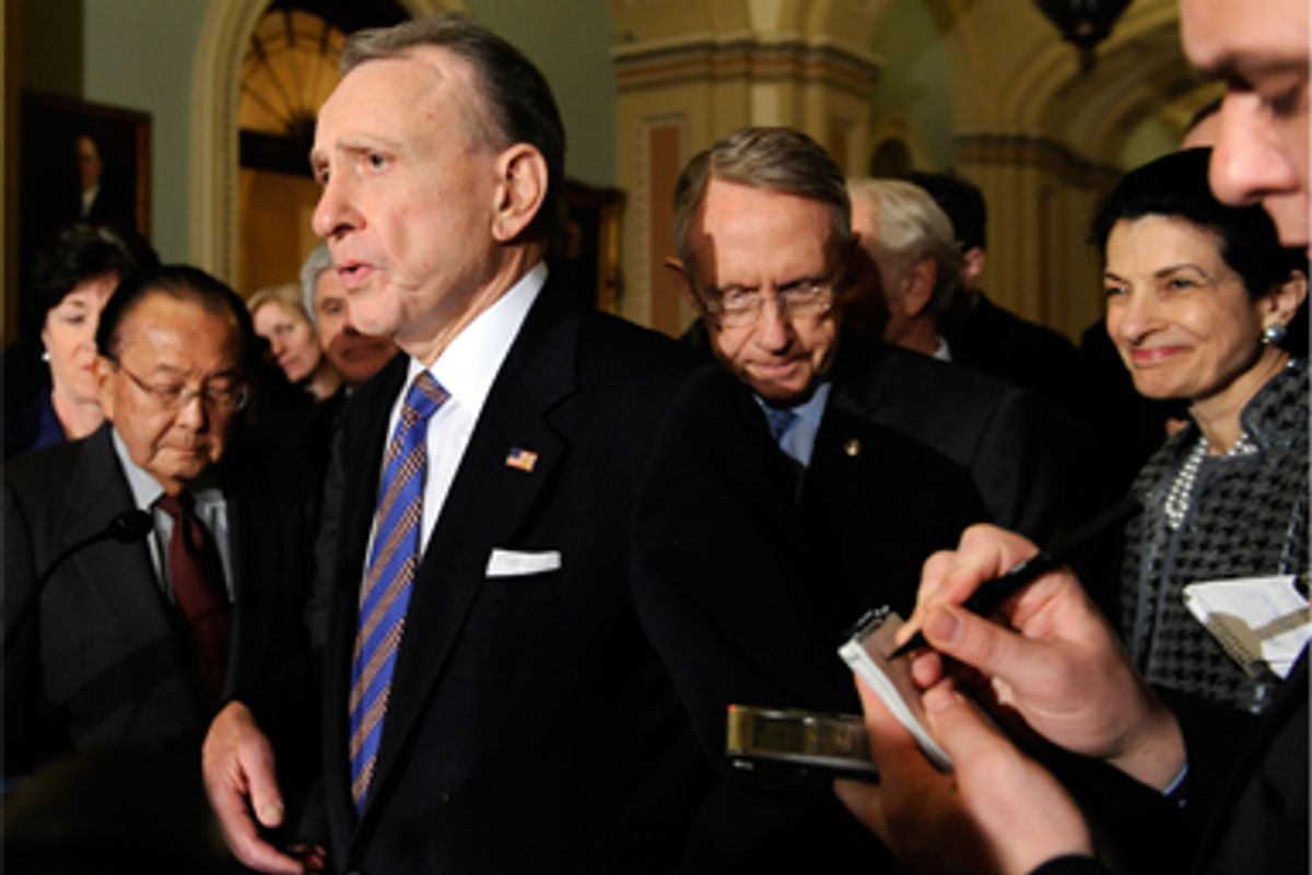 Sen. Arlen Specter , (then) R-Pa., center, speaks to reporters on Capitol Hill in Washington, Wednesday, Feb. 11, 2009, about the stimulus bill.