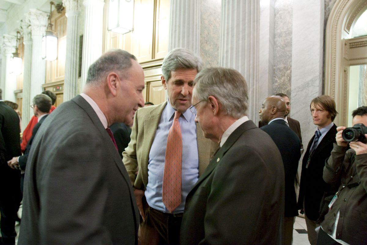 Sens. Charles Schumer, D-N.Y., l, and John Kerry, D-Mass., c, with Senate Majority Leader Harry Reid, D-Nev., chat following a 60-40 cloture vote which is the first step on passing a health care bill on Capitol Hill in Washington, Monday, Dec. 21, 2009.(AP Photo/Harry Hamburg) (Harry Hamburg)