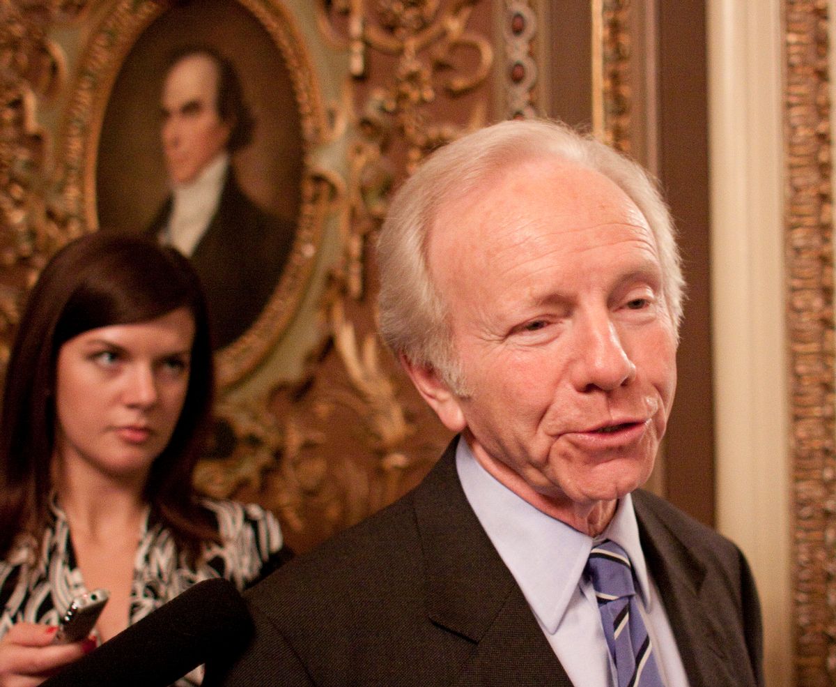 Sen. Joseph Lieberman, I-Conn., talks to reporters after leaving a Democratic caucus outside of the Senate Chamber on Capitol Hill in Washington, Wednesday, Dec. 9, 2009.(AP Photo/Harry Hamburg) (Associated Press)