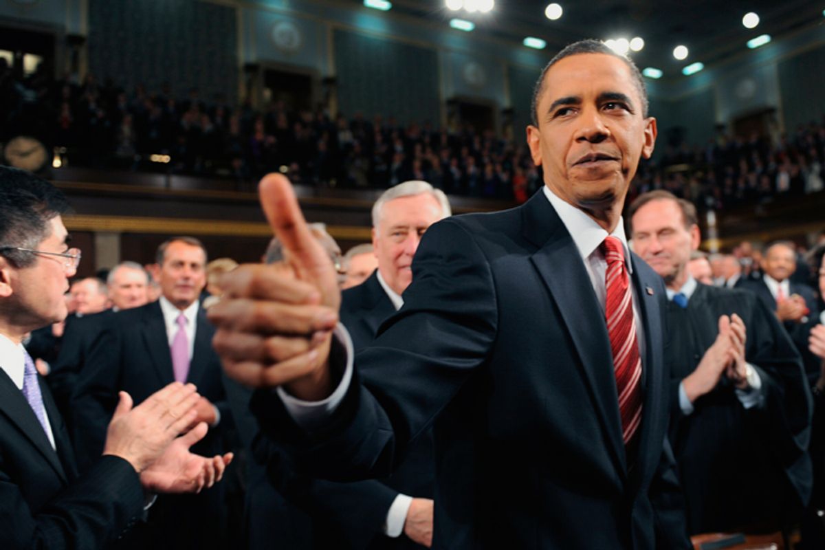 Barack Obama greets members of Congress on his way to deliver his first State of the Union address.