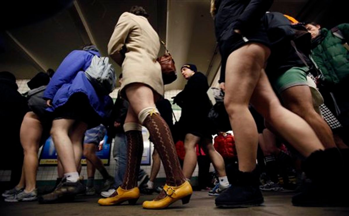 Participants in the 9th annual "No Pants Subway Ride" transfer to another train in New York, Sunday, Jan. 10, 2010.  (AP Photo/Seth Wenig) (AP)