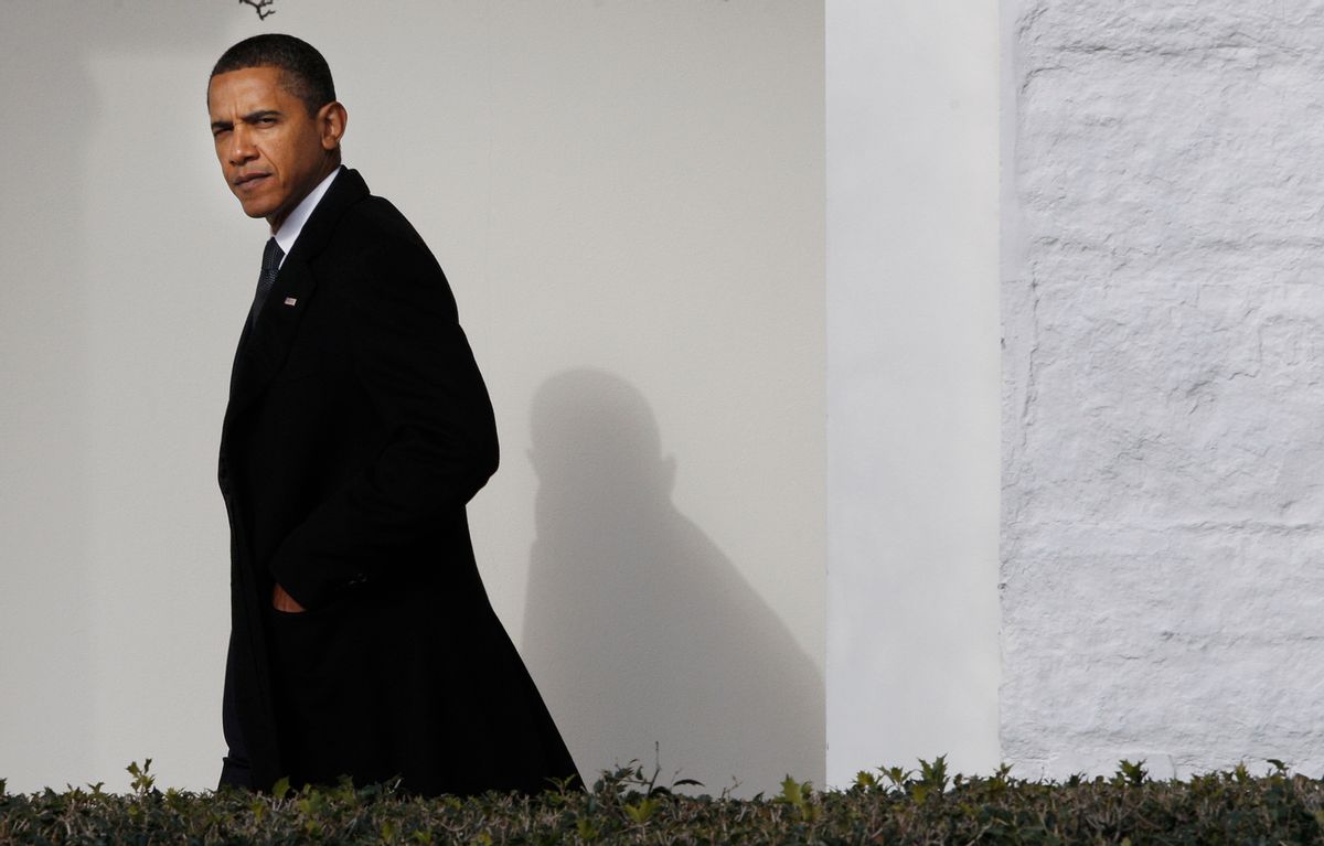 President Barack Obama walks back to the Oval Office of the White House in Washington, Tuesday, Jan. 12, 2010, after traveling to Delaware to attend the funeral services for Jean Biden, mother of Vice President Joe Biden. (AP Photo/Pablo Martinez Monsivais) (Associated Press)