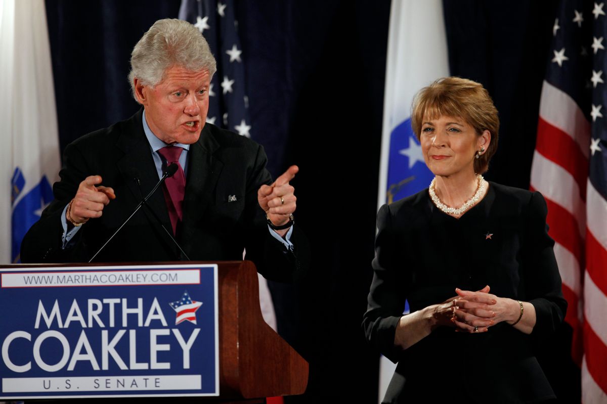 Former President Bill Clinton, left, addresses an audience as Martha Coakley, right, a candidate for the U.S. Senate seat left empty by the death of Sen. Edward M. Kennedy, D-Mass., looks on during a campaign rally in Boston, Friday, Jan. 15, 2010. (AP Photo/Steven Senne) (Associated Press)