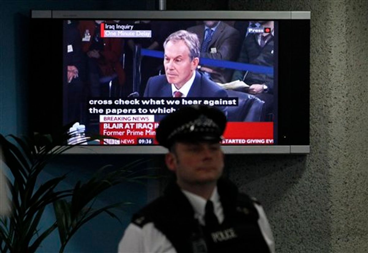 A police officer stands in front of a television screen in the foyer of the venue hosting the Iraq Inquiry in London, as Britain's former Prime Minister Tony Blair speaks, Friday, Jan. 29, 2010. Blair faced tough questioning Friday on his controversial decision to back the 2003 U.S.-led invasion of Iraq, a pledge that led to widespread protests in Britain and weakened his standing as leader. (AP Photo/Matt Dunham) (AP)