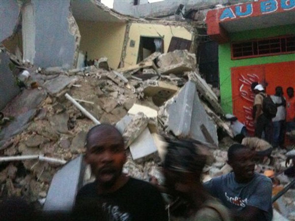 **RETRANSMISSION FOR IMPROVED QUALITY** This photo provided by Carel Pedre shows people running past rubble of a damaged building in Port-au-Prince, Haiti, Tuesday, Jan. 12, 2010. The largest earthquake ever recorded in the area shook Haiti on Tuesday, collapsing a hospital where people screamed for help. (AP Photo/Carel Pedre) MANDATORY CREDIT: CAREL PEDRE; NO SALES  (AP)