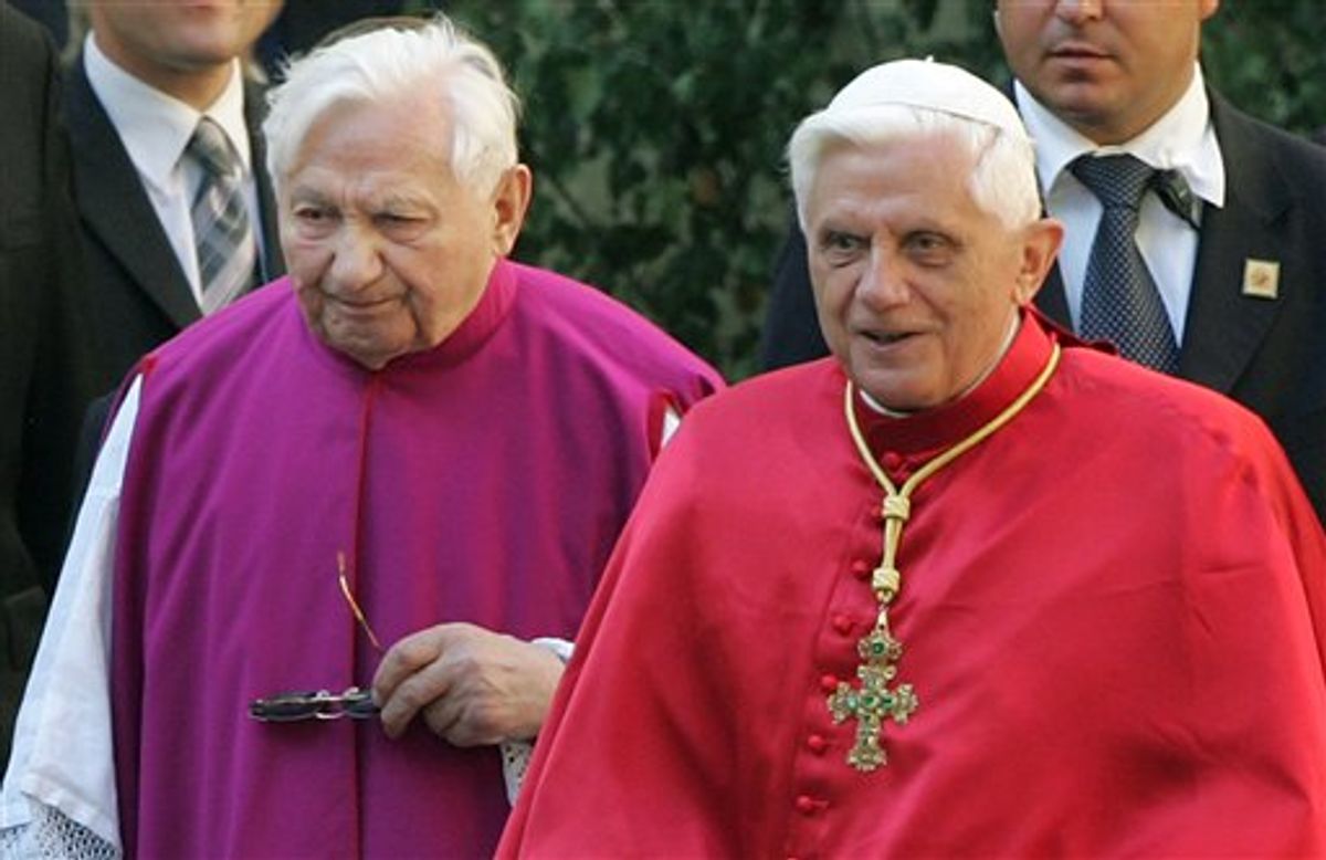 FILE - In this Sept. 13, 2006 file picture Pope Benedict XVI, right, walks with his brother priest Georg Ratzinger in Regensburg, southern Germany. The pope's brother says in a newspaper interview that he slapped pupils across the face after he took over a renowned German boys' choir in the 1960s. He also says he was aware of allegations of physical abuse at an elementary school linked to the choir, but did nothing about it.  In an interview with the Passauer Neue Presse published Tuesday March 9, 2010 , he said "repeatedly administered a slap in the face" to pupils at the Regensburger Domspatzen boys choir. He says it was common then and he stopped after Germany banned corporal punishment in 1980. (AP Photo/Diether Endlicher,File) (AP)