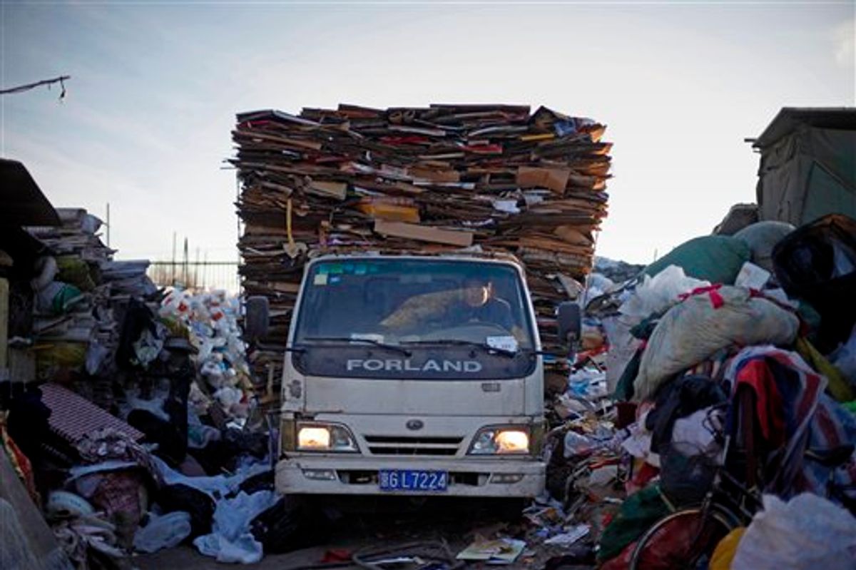 A Chinese driver with a truck full of cardboard set for recycling arrives at a recycling center in Beijing, China, Tuesday, Dec. 15, 2009. China, India and other developing nations boycotted U.N. climate talks Monday, bringing negotiations to a halt with their demand that rich countries discuss much deeper cuts in their greenhouse gas emissions. (AP Photo/Elizabeth Dalziel)  (AP)