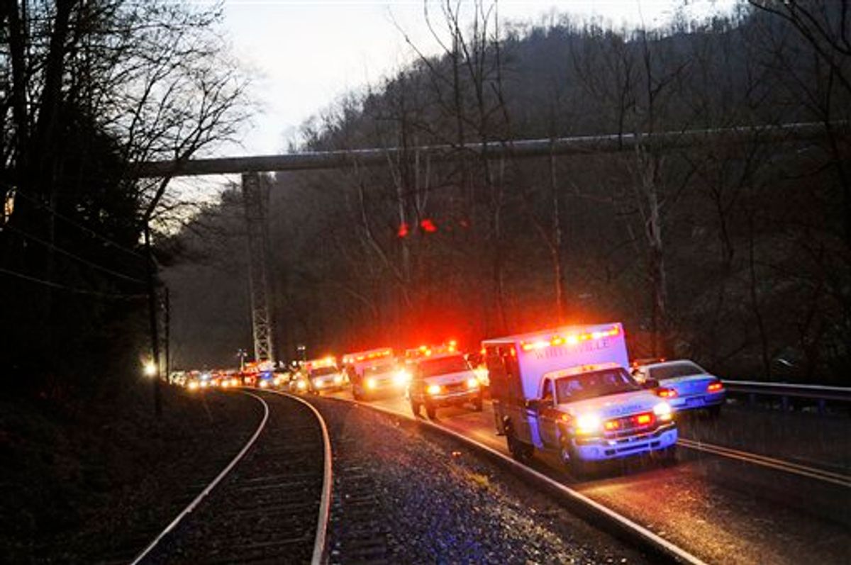 Emergency vehicles leave the entrance to Massey Energy's Upper Big Branch Coal Mine Monday, April 5, 2010 in Montcoal, W.Va. after an explosion at the underground coal mine. (AP Photo/Jeff Gentner) (AP)