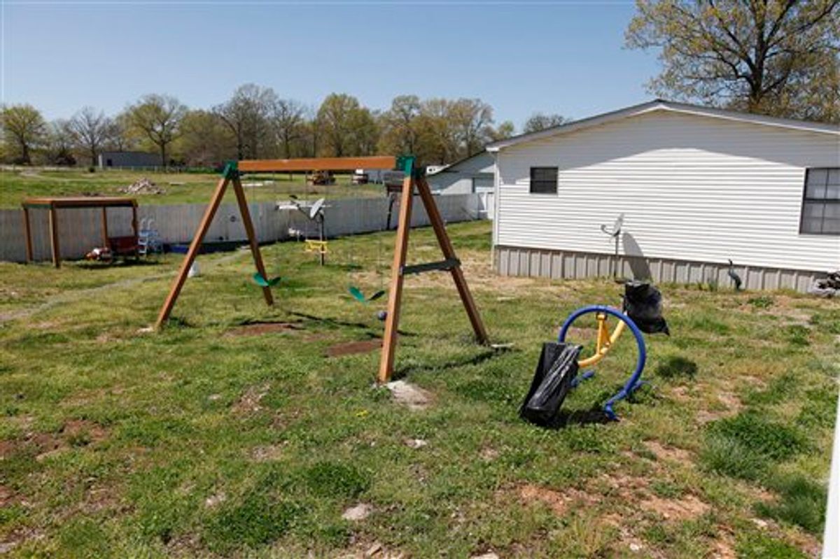 A swing set is seen in the backyard of Torry Hansen and Nancy Hansen's shared backyard in Shelbyville, Tenn. on Friday, April 9, 2010. Russia has threatened to suspend all child adoptions by U.S. families after a 7-year-old boy adopted by a woman from Tennessee was sent alone on a one-way flight back to Moscow with a note saying he was violent and had severe psychological problems. Artyom Savelyev was put on a plane by his adopted grandmother, Nancy Hansen. (AP Photo/Josh Anderson)  (AP)