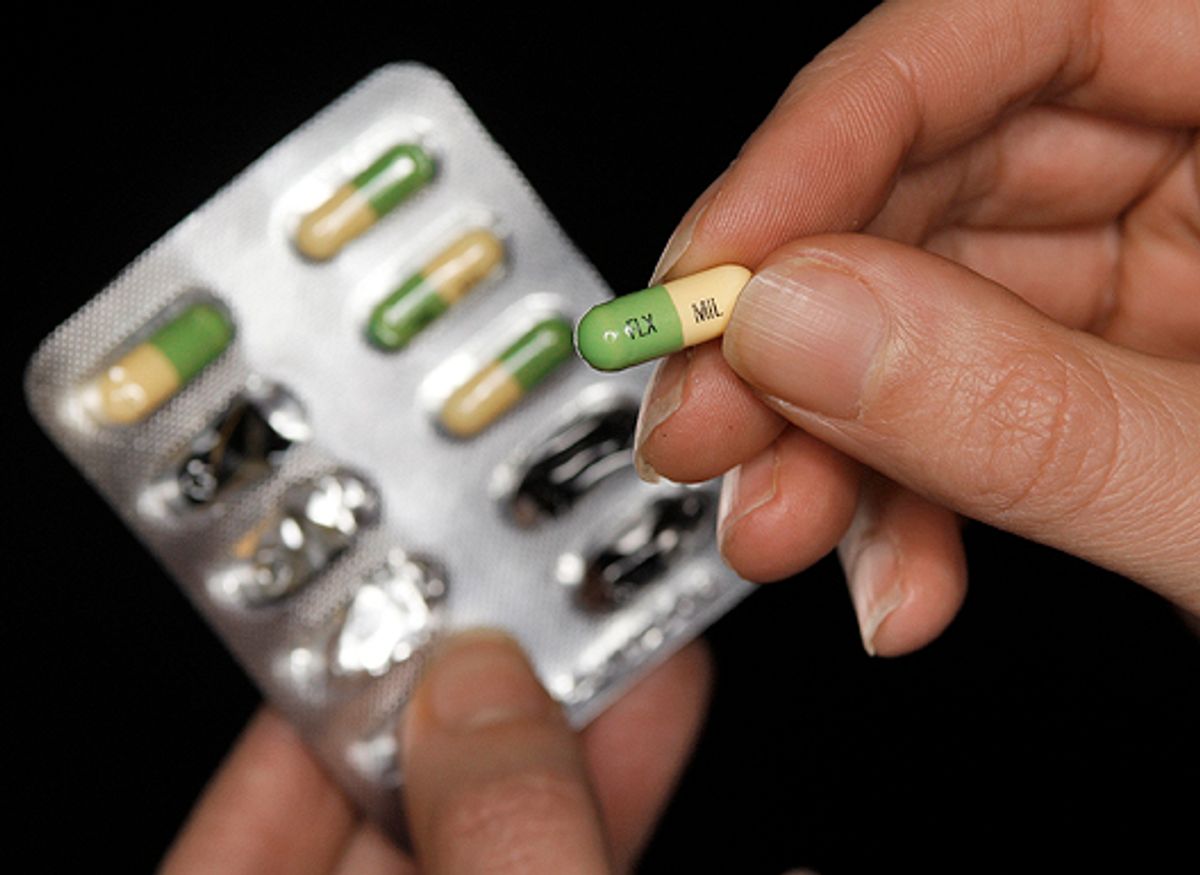 A woman holds a packet of the antidepressant drug Prozac, also known as fluoxetine,  in Leicester, central England February 26, 2008.  Antidepressant medications appear to help only very severely depressed people and work no better than placebos in many patients, British researchers said on Monday.     REUTERS/Darren Staples   (BRITAIN) (Â© Darren Staples / Reuters)