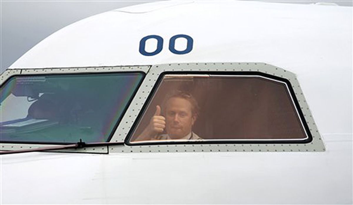 A pilot gives the thumps up to as gets the go ahead to leave Belfast City Airport, Northern Ireland, Tuesday, April, 20, 2010.  Europe began allowing limited air traffic to resume, giving hope to millions of travelers stranded around the world when ash from a volcano in Iceland choked the jet age to a halt.  (AP Photo/Peter Morrison) (Peter Morrison)