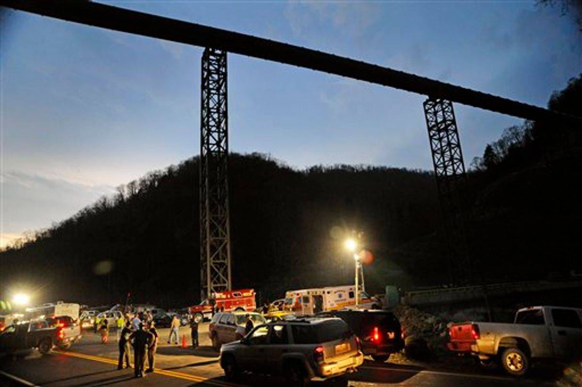 West Virginia State Police direct traffic at the entrance to Massey Energy's Upper Big Branch Coal Mine Monday, April 5, 2010 in Montcoal, W.Va.  (AP Photo/Jeff Gentner) (AP)