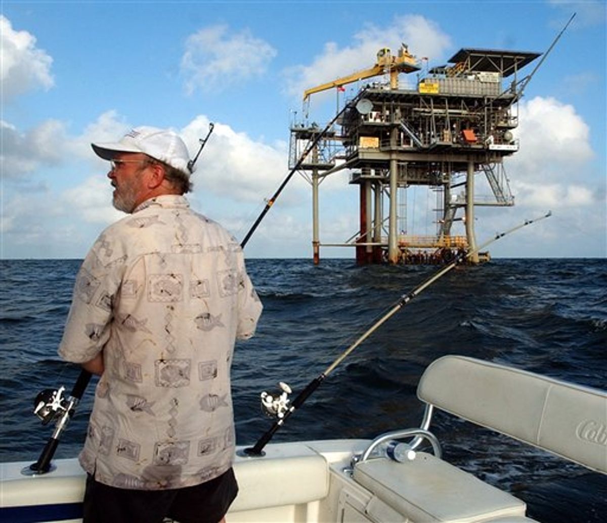 FILE - In a  in this Friday, May 9, 2003 file photo, angler Andy Hails, of Montgomery, Ala., checks the fishing lines on his boat as he trolls the Gulf of Mexico near a natural gas well off the Alabama coast near Gulf Shores, Ala. President Obama announced his new offshore drilling policy Wednesday, March 31, 2010. President Obama is allowing oil drilling off Virginia's shorelines and considering it for a large chunk of the Atlantic seaboard. At the same time, he's rejecting some new drilling sites that had been planned in Alaska.   (AP Photo/Dave Martin, File) (AP)
