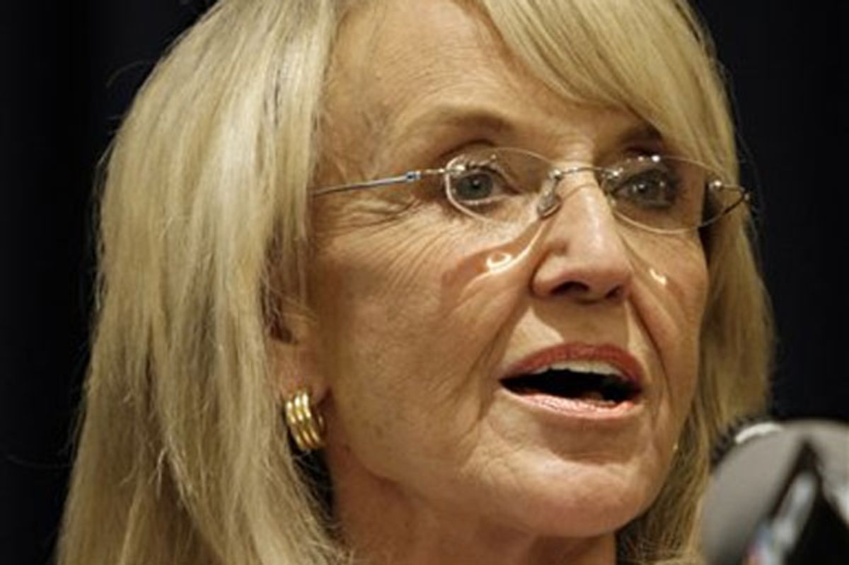This April 14, 2010 photo shows Arizona Governor Jan Brewer at the Capitol in Phoenix. Brewer has called for more troops along the state's border with Mexico on Thursday, April 23, 2010, two days before a deadline for her to approve or strike down the nation's toughest legislation on illegal immigration.       