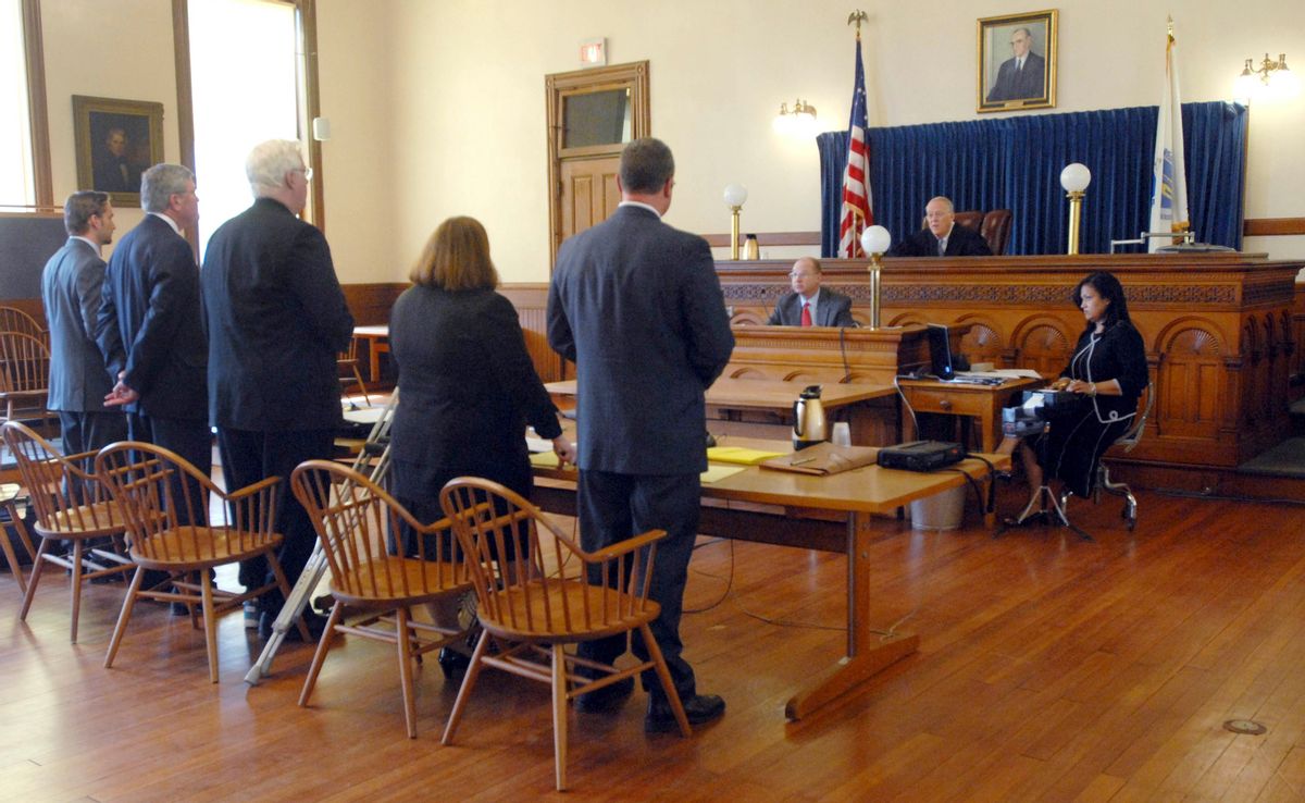 Judge Judd J. Carhart,  right, presides IN Hampshire Superior Court over the arraignment of three Massachusetts teenagers, who waived their rights to appear yet pleaded not guilty through their lawyers, left, Tuesday, April 6, 2010, in Northampton, Mass.. The teens are among several charged in the bullying of Phoebe Prince, 15, who committed suicide in January after what prosecutors call months of threats and harassment. (AP Photo/Carol Lollis, Pool) (Carol Lollis)