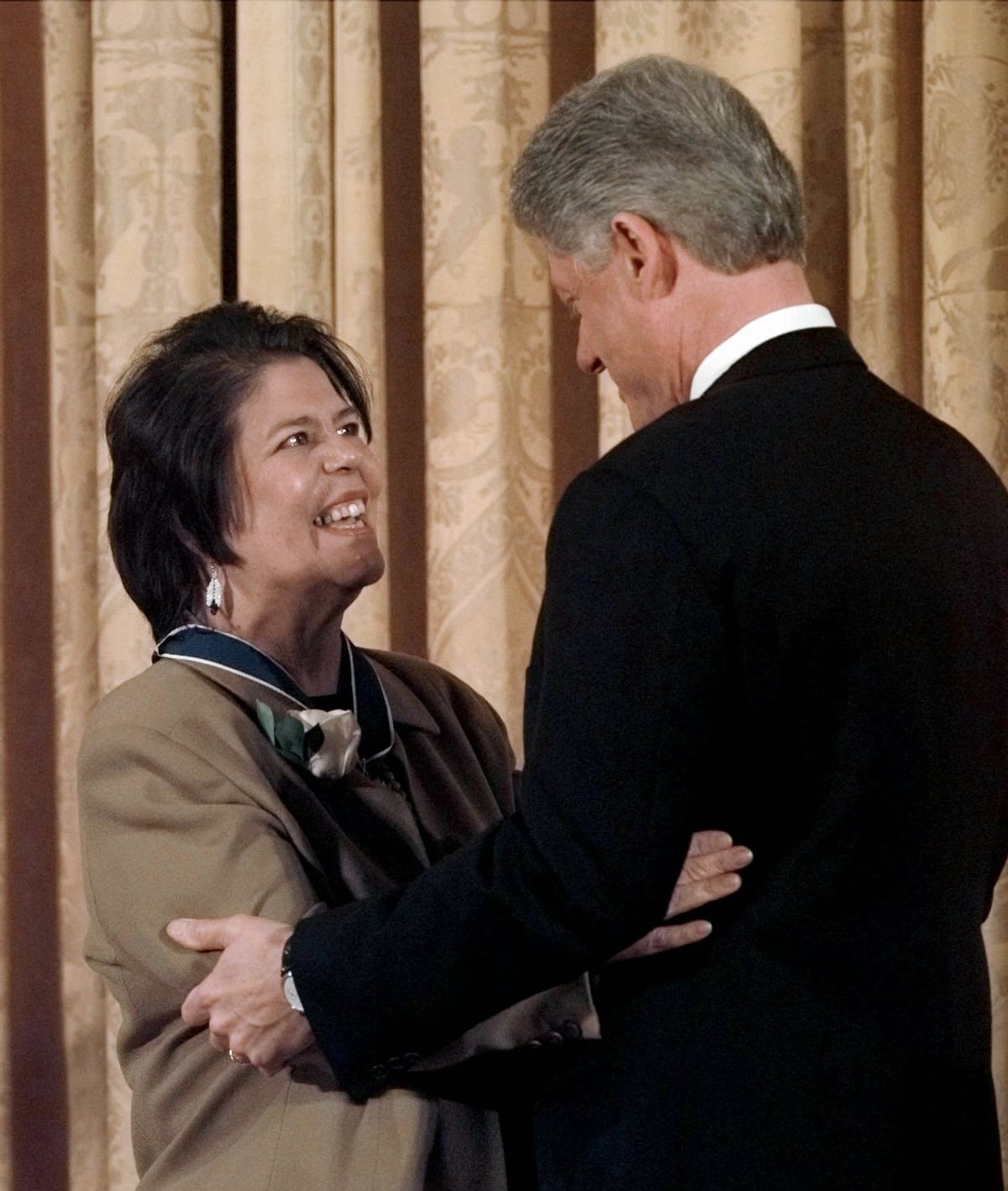 FILE - In this Jan. 15, 1998 file photo, President Bill Clinton hugs former Cherokee Nation chief Wilma Mankiller after presenting her with a Presidential Medal of Freedom during a ceremony at the White House. Mankiller, one of the few women ever to lead a major American Indian tribe, died Tuesday April 6, 2010 after battling pancreatic cancer. She was 64. (AP Photo/Dennis Cook, File)  (Associated Press)