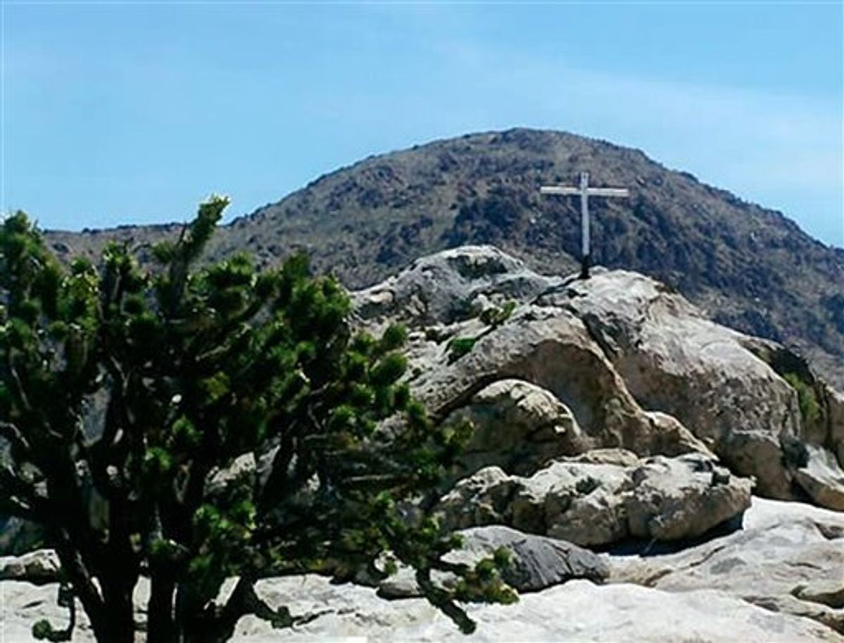 This undated photo taken by Henry and Wanda Sandoz and made available Wednesday, Oct. 7, 2009, by the Liberty Legal Institute shows the memorial known as the "Mojave Cross", on an outcrop known as Sunrise Rock in the Mojave National Preserve, in Calif. The Supreme Court has said a federal court went too far in ordering the removal of a congressionally endorsed war memorial cross from its longtime home in California. (AP Photo/Liberty Legal Institute, Henry and Wanda Sandoz) NO SALES (AP)