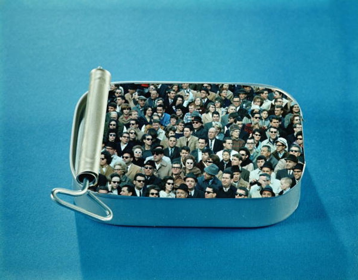 UNITED STATES - CIRCA 1960s:  Crowd of men and women packed inside open sardine tin.  (Photo by H. Armstrong Roberts/Retrofile/Getty Images) (Retrofile/getty Images)