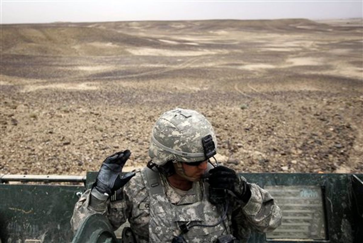 In this April 26, 2010, photo, U.S. Army Lt. David Cummings, of Raleigh, N.C., talks on the radio with soldiers from his platoon while out patrolling areas off of Highway 1 with A Troop, 2nd Battalion, 1st Infantry Regiment, 5th Stryker Brigade in the Kandahar province of Afghanistan. The American-led effort to wrest control of southern Afghanistan is off to a slow start and the political clock is ticking as U.S. troops head into what could be the bloodiest fight yet in the eight-year war. (AP Photo/Julie Jacobson) (AP)
