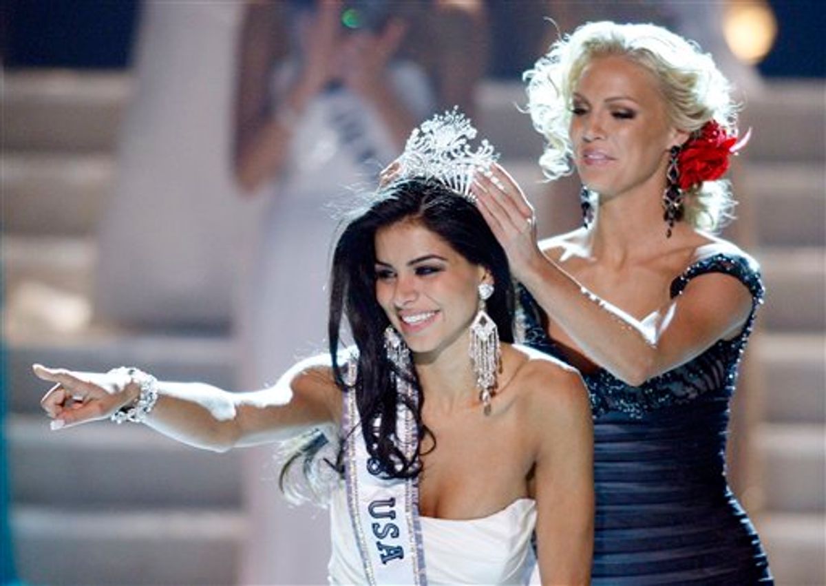 Miss Michigan Rima Fakih reacts as she is crowned Miss USA 2010 Sunday, May 16, 2010 in Las Vegas.  (AP Photo/Isaac Brekken) (AP)