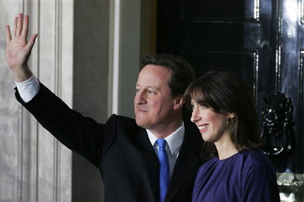 Britain's new Prime Minister David Cameron and his wife Samantha wave to the media outside 10 Downing Street in London,Tuesday, May, 11  2010. (AP Photo/Tim Hales)    (AP)