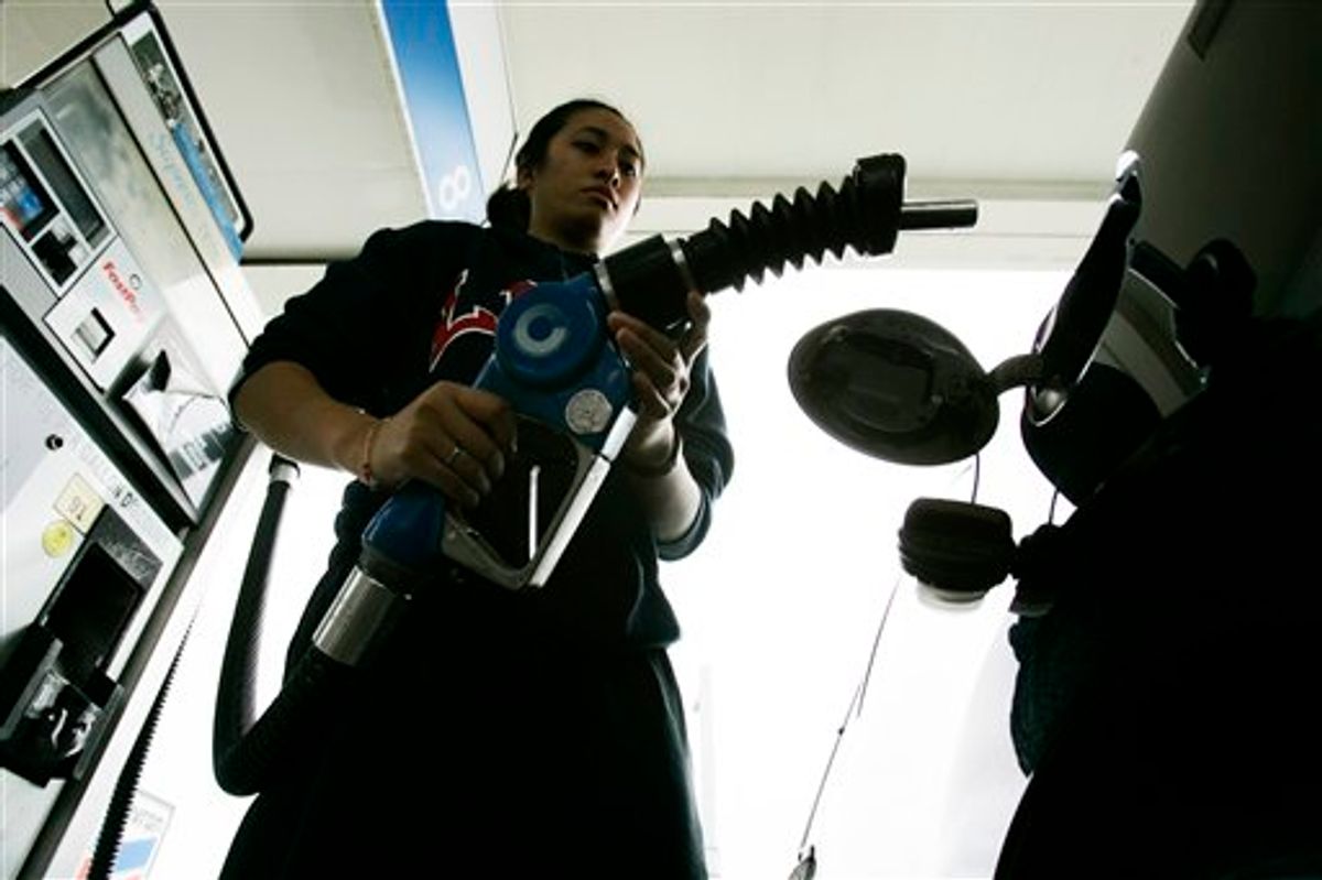 FILE - In this June 9, 2009 file photo, a Chevron customer pumps gas at a dealership in South San Francisco, Calif. Many analysts who predicted that retail gasoline prices would top $3 per gallon for a short time this summer, 2010, now are looking for prices to move lower or at least stabilize heading into the summer driver season. (AP Photo/Paul Sakuma, file) (AP)