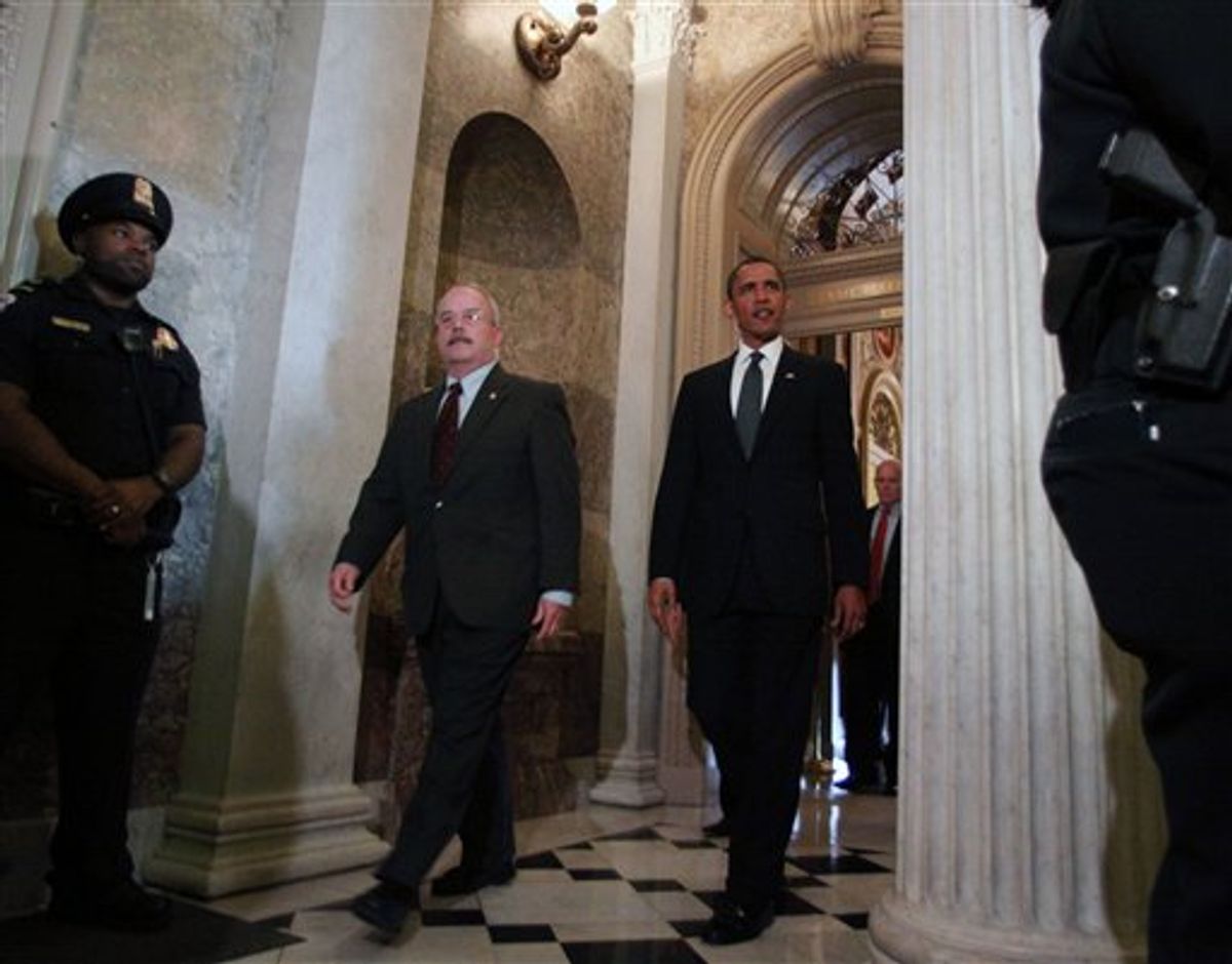 President Barack Obama, escorted by Senate Sergeant-at-Arms Terrance Gainer, leaves Capitol Hill in Washington, Tuesday, May 25, 2010, after a meeting with Senate Republicans behind closed doors for talks ranging from jobs to the massive Gulf oil spill and prospects for strengthening border security this election year. (AP Photo/Lauren Victoria Burke) (AP)