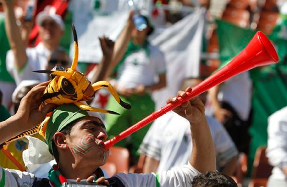 An Algeria fan blows a vuvuzela during the World Cup group C soccer match between Algeria and Slovenia at Peter Mokaba Stadium in Polokwane, South Africa, Sunday, June 13, 2010.  (AP Photo/Martin Mejia) (AP)