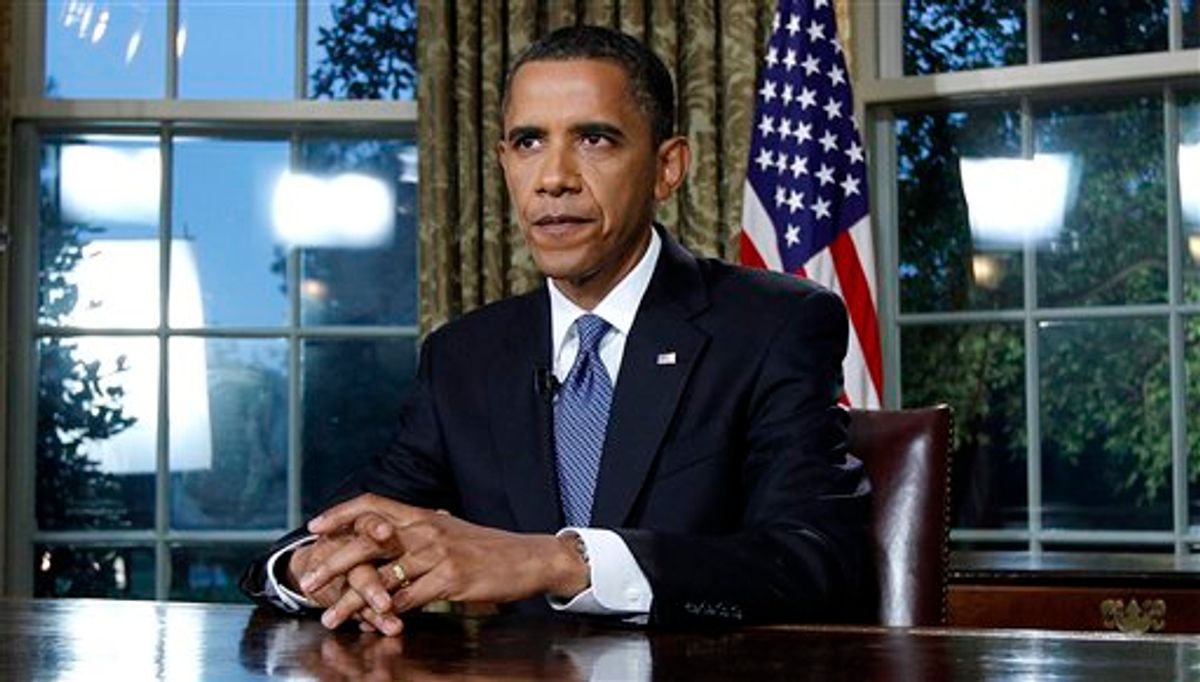 President Barack Obama is photographed after delivering a televised address from the Oval Office of the White House in Washington, Tuesday June 15, 2010. President Obama said the nation will continue to fight the oil spill in the Gulf of Mexico for "as long as it takes." (AP Photo/Alex Brandon) (AP)