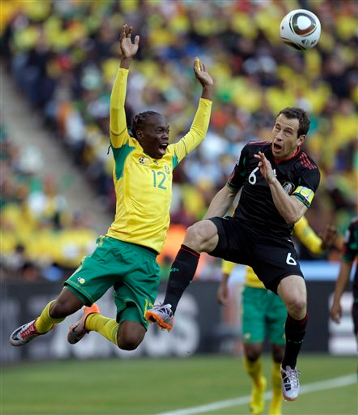 South Africa's Reneilwe Letsholonyane, left, and Mexico's Gerardo Torrado vie for the ball during the World Cup group A soccer match between South Africa and Mexico at Soccer City in Johannesburg, South Africa, on Friday, June 11, 2010. (AP Photo/Themba Hadebe)   (AP)