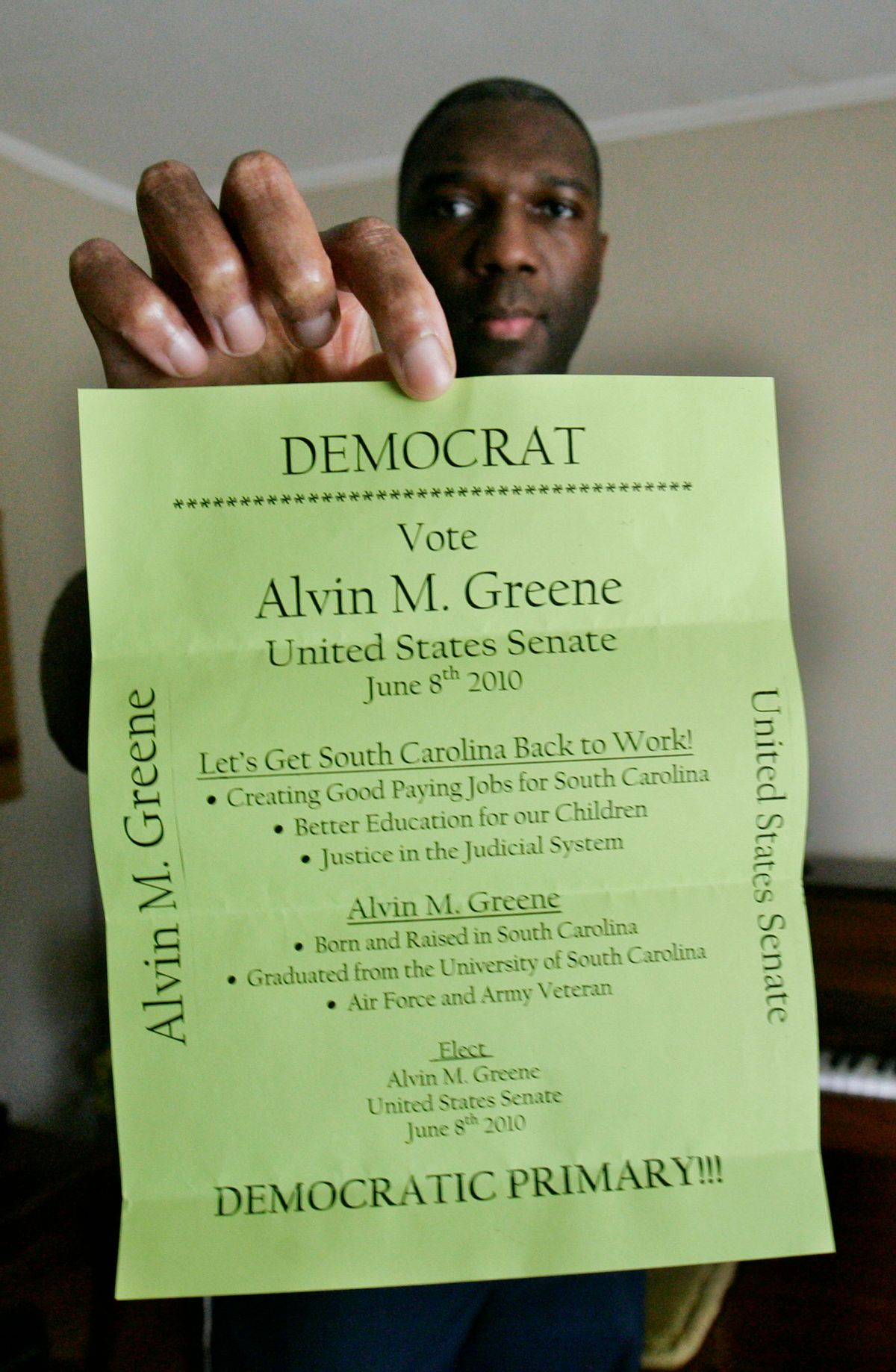 South Carolina Democratic candidate for U.S. Senate, Alvin M Greene, holds his own personal copy of his campaign flyer he used to show people as he campaigned in Manning, S.C. Wednesday, June 9, 2010 after winning the Democratic nomination in yesterday's South Carolina primary elections. Greene  will face incumbent Rep. Sen. Jim DeMint in the November elections.(AP Photo/Mary Ann Chastain) (Mary Ann Chastain)