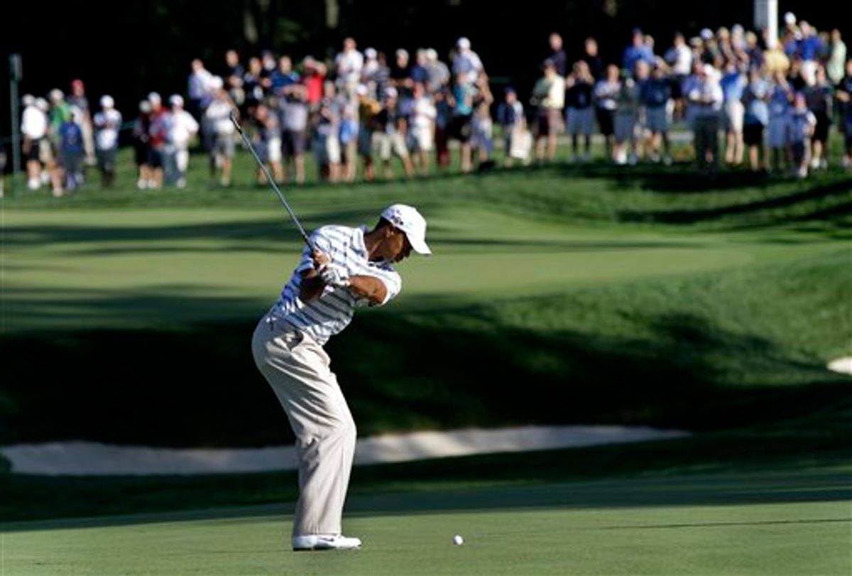 Tiger Woods hits to the seventh green while playing in a Pro-Am for the AT&T National golf tournament at Aronimink Golf Club in Newtown Square, Pa., Wednesday, June 30, 2010. (AP Photo/Rob Carr)   (AP)