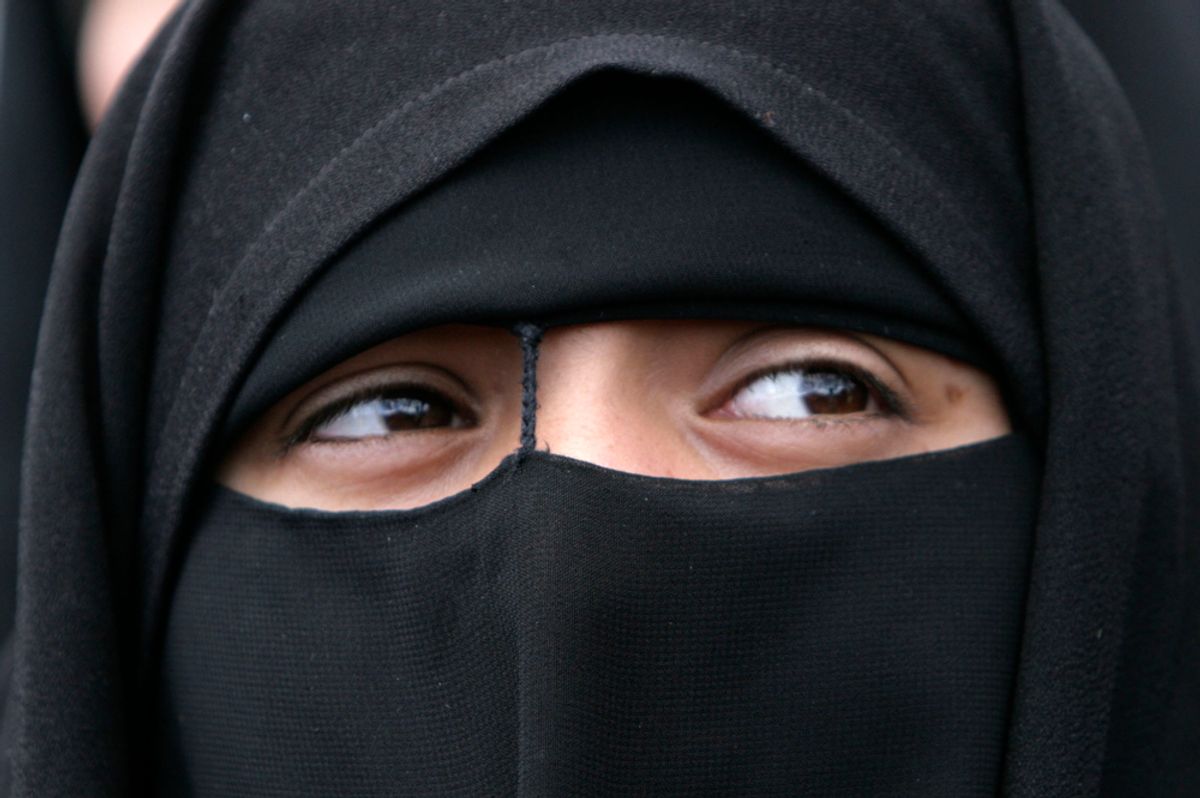 A Shiite counter protester takes part in a demonstration by some 1,000 male and female Afghans in Kabul, Afghanistan, on Wednesday, April 15, 2009.