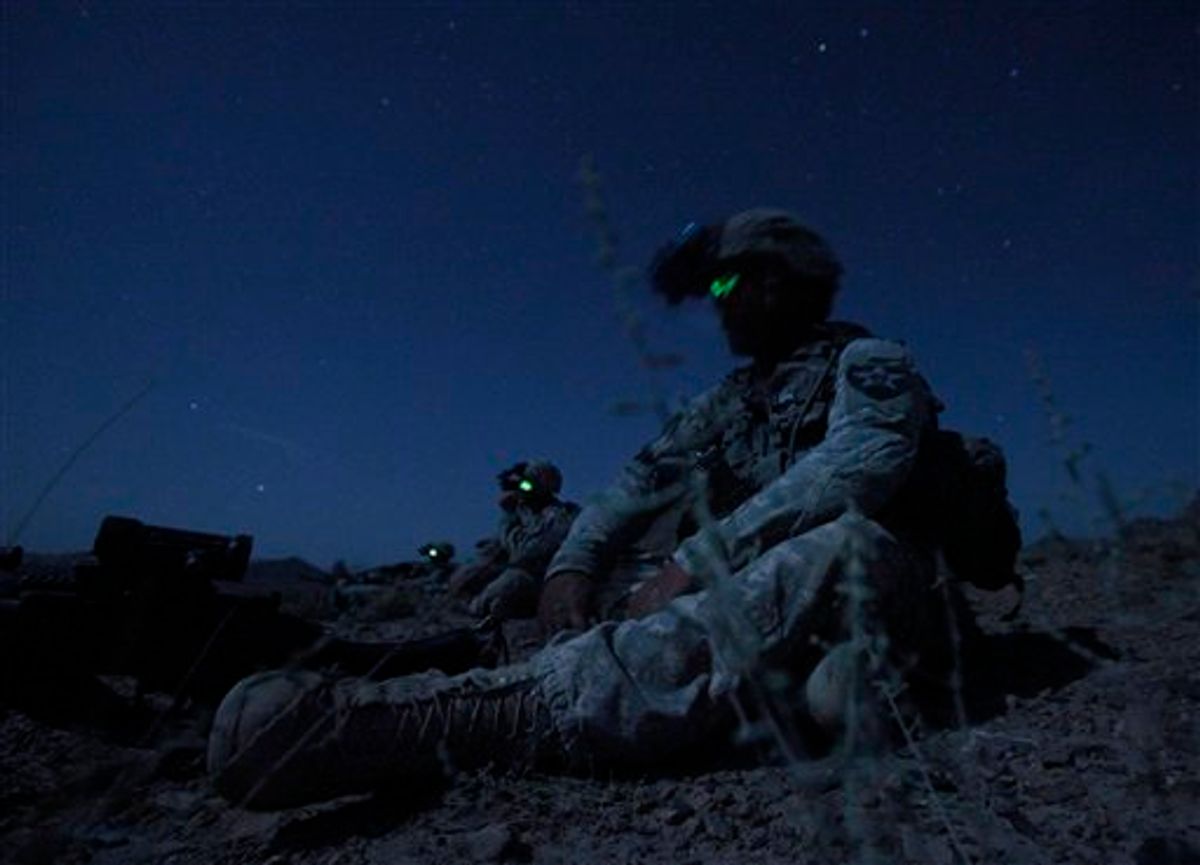 United States Army Spc. Kevin O'Connor, of Hingham, Mass., right, sits in the darkness with other members of  United States Army Spc. Kevin O'Connor, of Hingham, Mass. during an ambush set up Friday, May 21, 2010 to catch Taliban fighters who had fired on their outpost earlier in the week, in Afghanistan's Kandahar province. (AP Photo/Julie Jacobson)  (AP)
